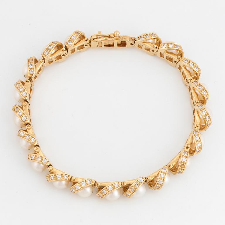 14K gold, diamonds and cultures pearl bracelet.