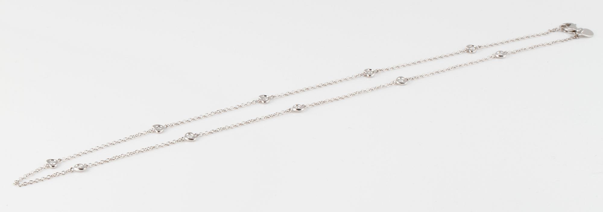 COLLIER, 18K vitguld med 10 briljantslipade diamanter ca 0.25 ct. Vikt 3,3 gram.