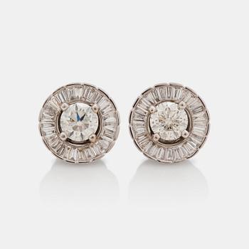 644. A pair of earrings with brilliant- and baguette- cut diamonds.