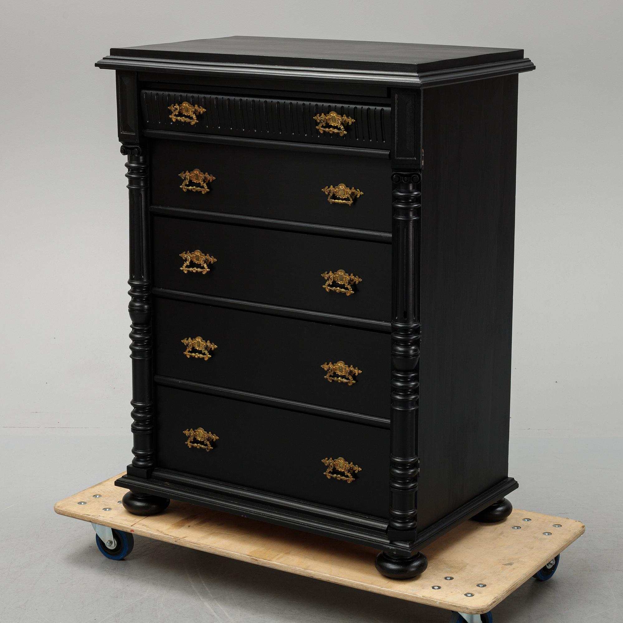 A painted chest of drawers, circa 1900.