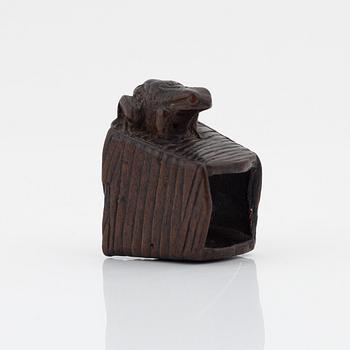 A Japanese wood netsuke of a frog, Masanao Yamada,
Edo period (1615-1868), 19th century.