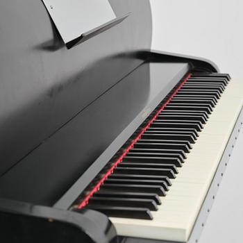 Poul Henningsen, a "PH Upright Piano", executed by Andreas Christensen, Denmark, 1940s.