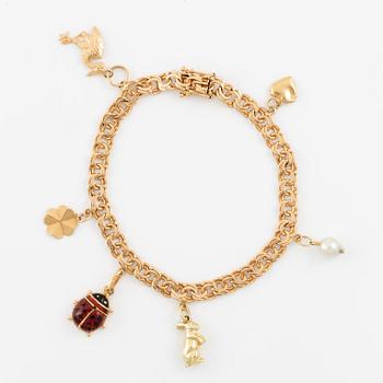 Armband 18K guld med berlocker, bismarck.