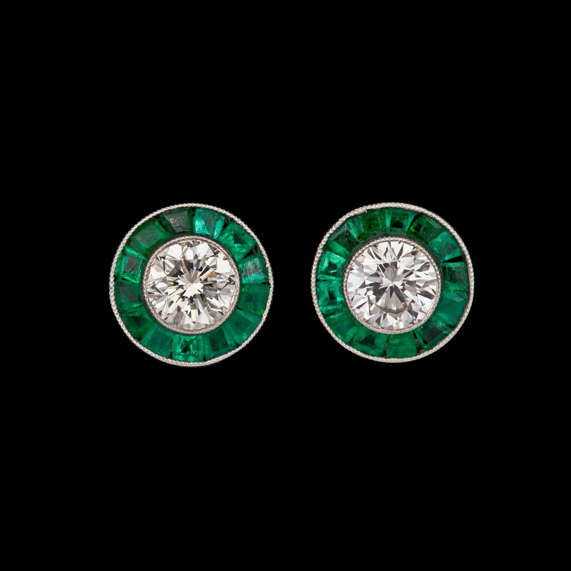 A pair of tapered bagutte and brilliant cut diamond earrings.