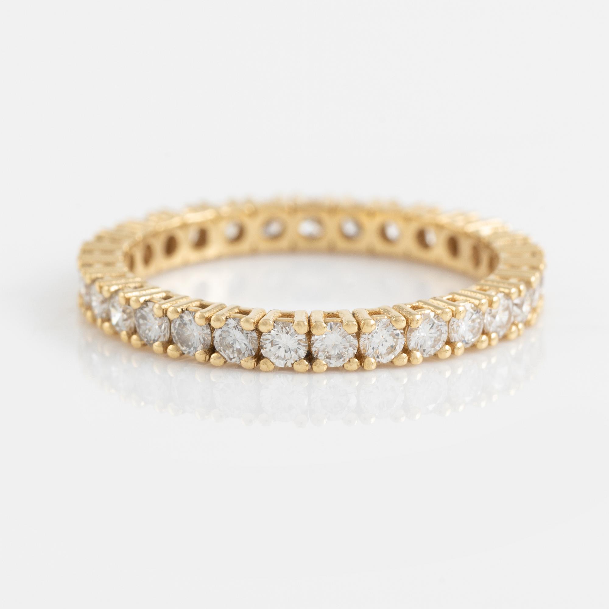 Brilliant cut diamond eternity ring.