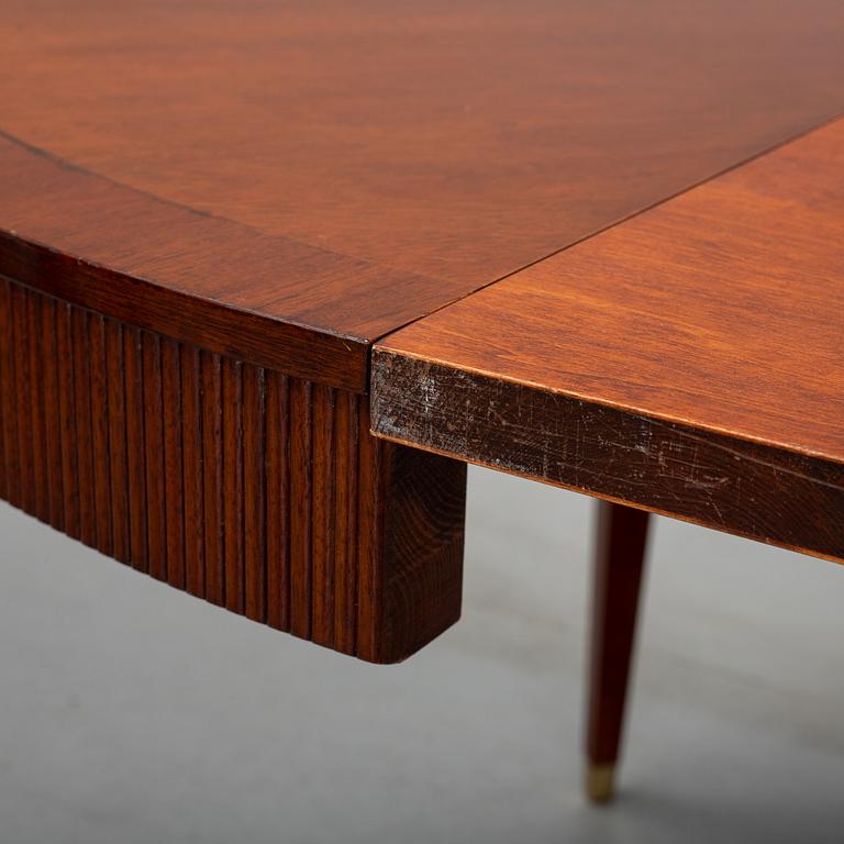 A gustavian style mahogany dining table from the mid 20th century.