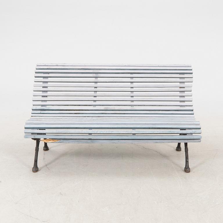 A cast iron early 1900s garden sofa.