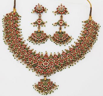 An Indian demi parure comprising a necklace and a pair of earrings.