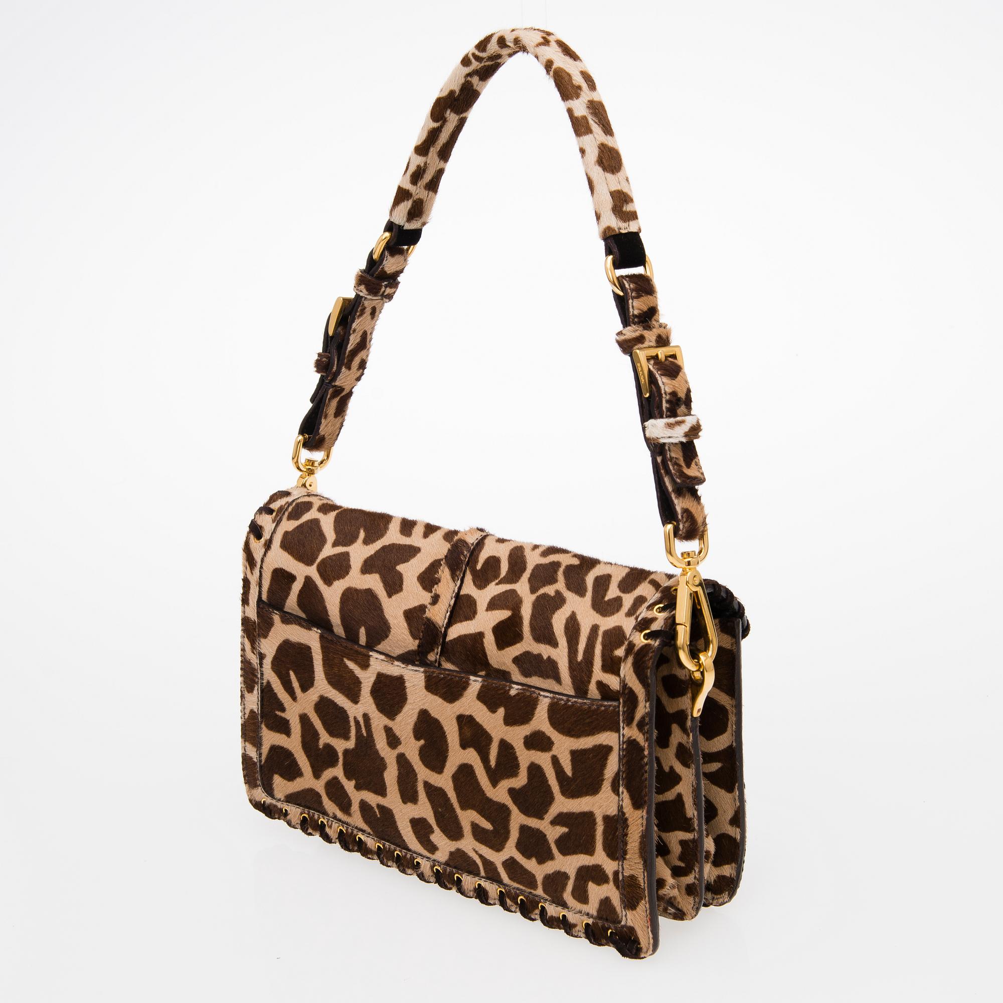 An Animal Print Pony Hair Shoulder Bag.