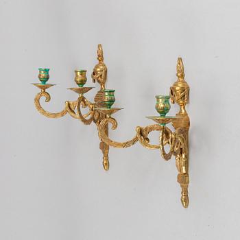 A pair of wall sconces, Louis XVI style, early 20th century.
