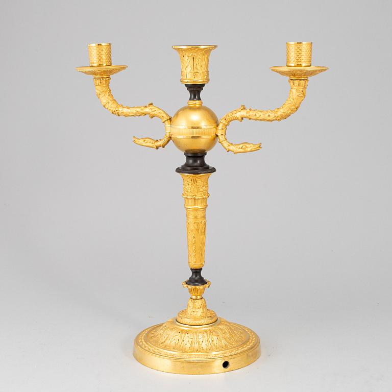 An empire ormolu candelabrum, early 19th century.