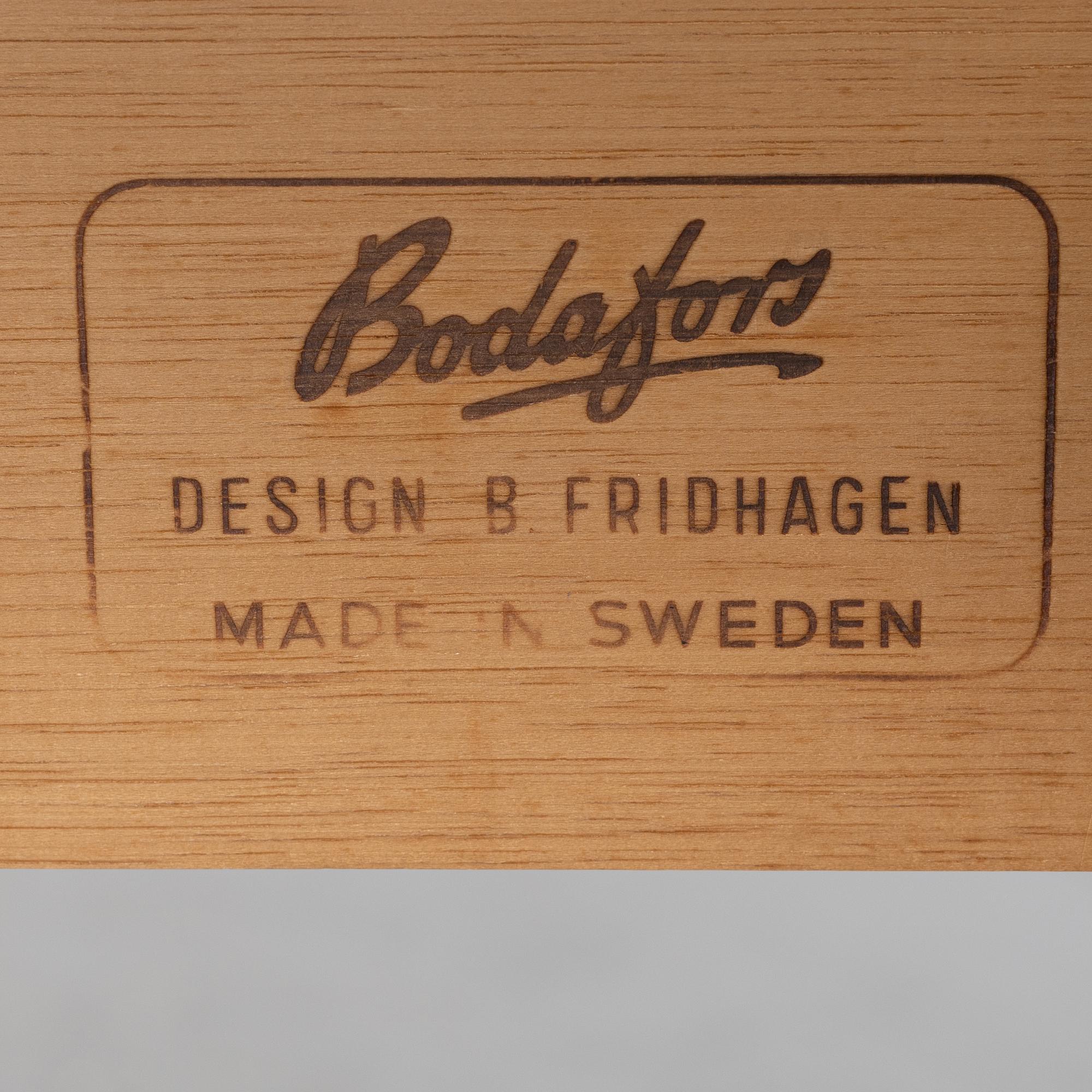 Bertil Fridhagen, a 'Diamant' walnut veneered dining table, with four additional leaves.  Bodafors.