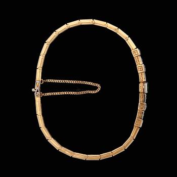 An emerald and diamond bangle, c. 1930's.