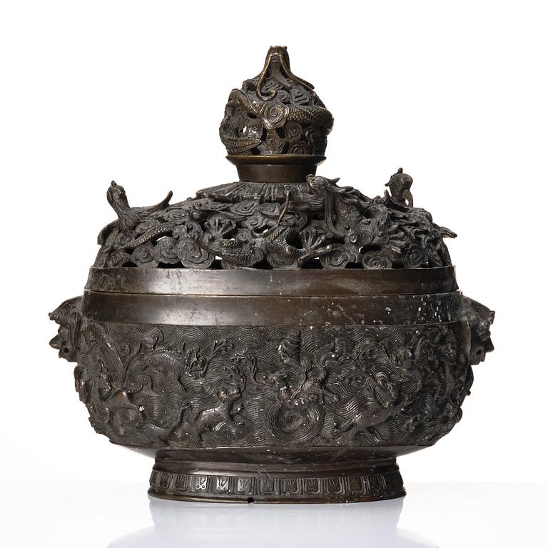 A bronze reticulated incense burner with cover, Qing dynasty (1644-1912).