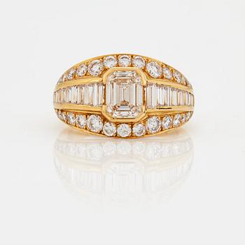 A RING set with an emerald-cut diamond.