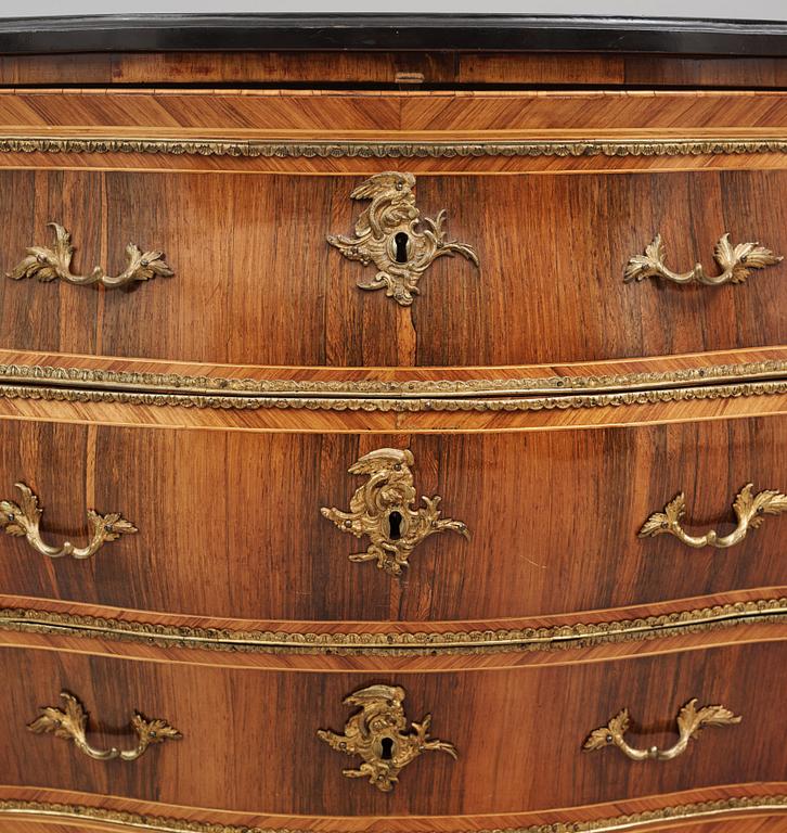 A rococo parquetry and gilt brass-mounted commode possibly by C. Åhman (master in Stockholm 1748-1783).