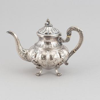A silver teapot, creamer and sugar bowl, swedish import mark.