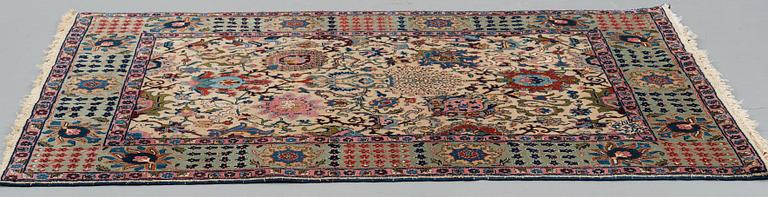 A RUG, a semi-antique Tabriz, ca 198 x 142 cm.