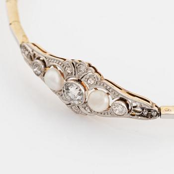 A 14K gold and platinum bracelet set with old- and rose-cut diamonds and pearls.