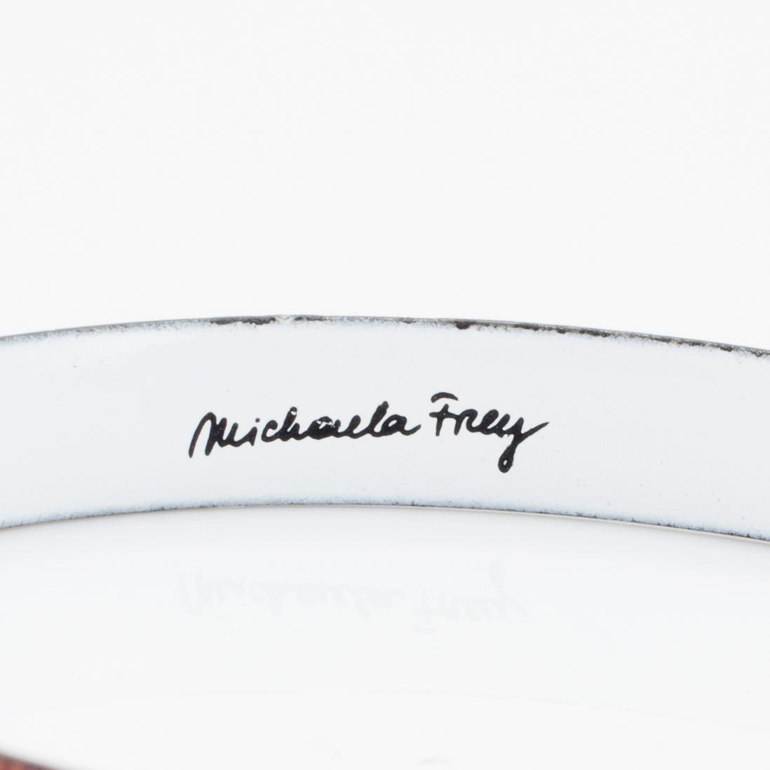 A bangle by Michaela Frey with multi-coloured enamel decoration.