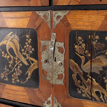 A Japenese partially lacquered hanging cabinet, early 20th century.
