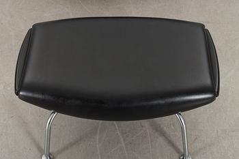 HANS J WEGNER, "Ox chair" lounge chair and stool.