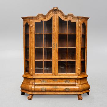 A Rococo style display cabinet, the Netherlands, circa 1900.