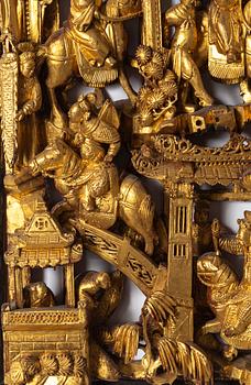 A carved and gilded Chinese panel, Qing dynasty, 19th Century.