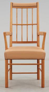 A Josef Frank cherry and beige leather armchair, Svenskt Tenn 2007, model 652.