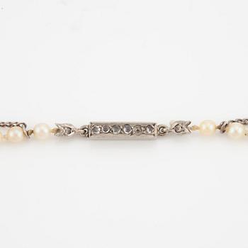 Necklace with cultured graduated pearls, white gold clasp with rose-cut diamonds.