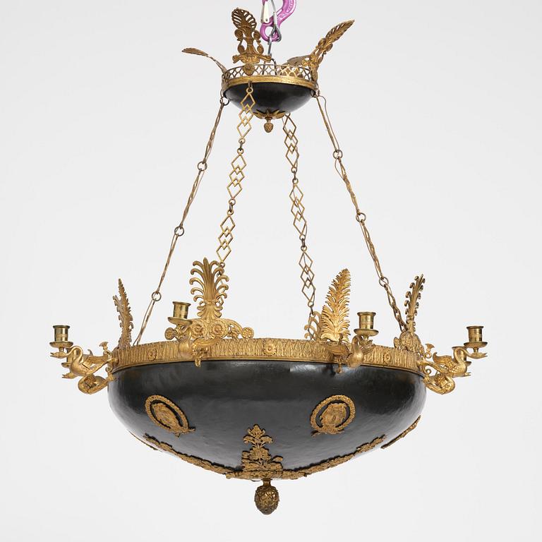 A presumably Russian Empire gilt and patinated bronze nine-branch chandelier, 19th century.