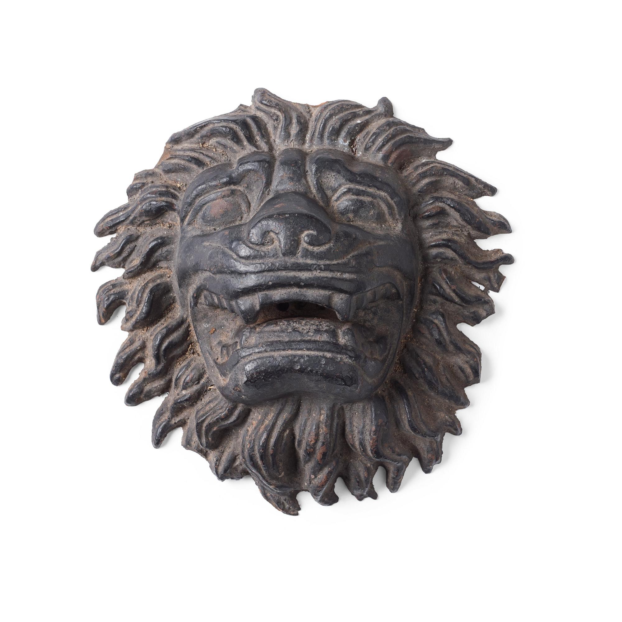 Anna Petrus, a cast iron mascaron in the shape of a lion's head.
