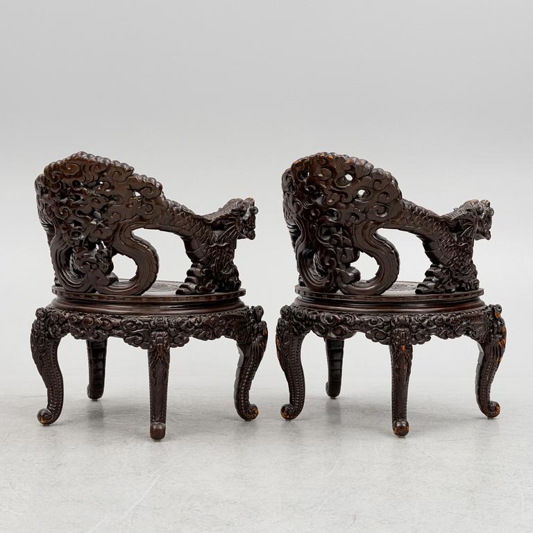 A pair of Chinese hardwood chairs, 20th century.