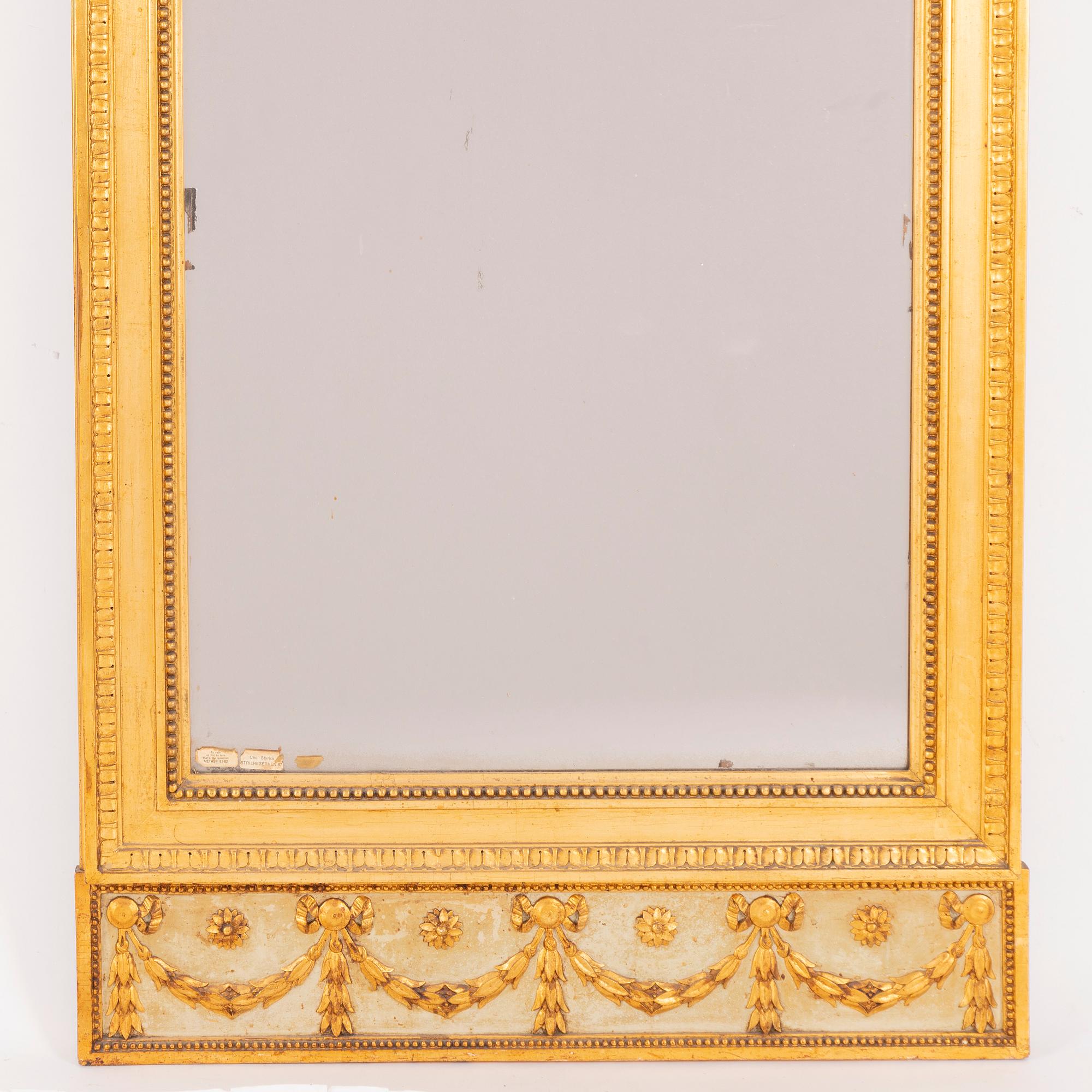 A late-Gustavian giltwood mirror, Stockholm, late 18th century.