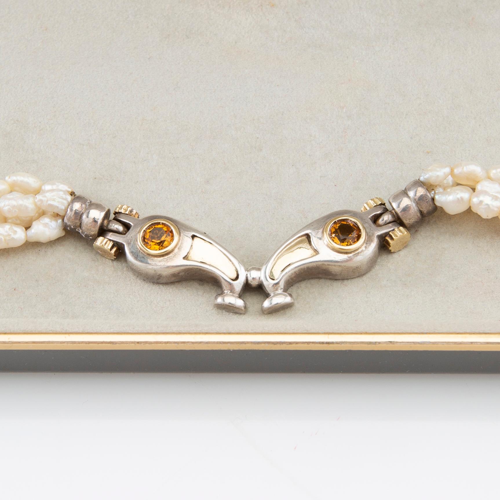 Tonino Lamborghini, Necklace of cultured pearls with a pendant of 18K gold, silver, and faceted citrines.
