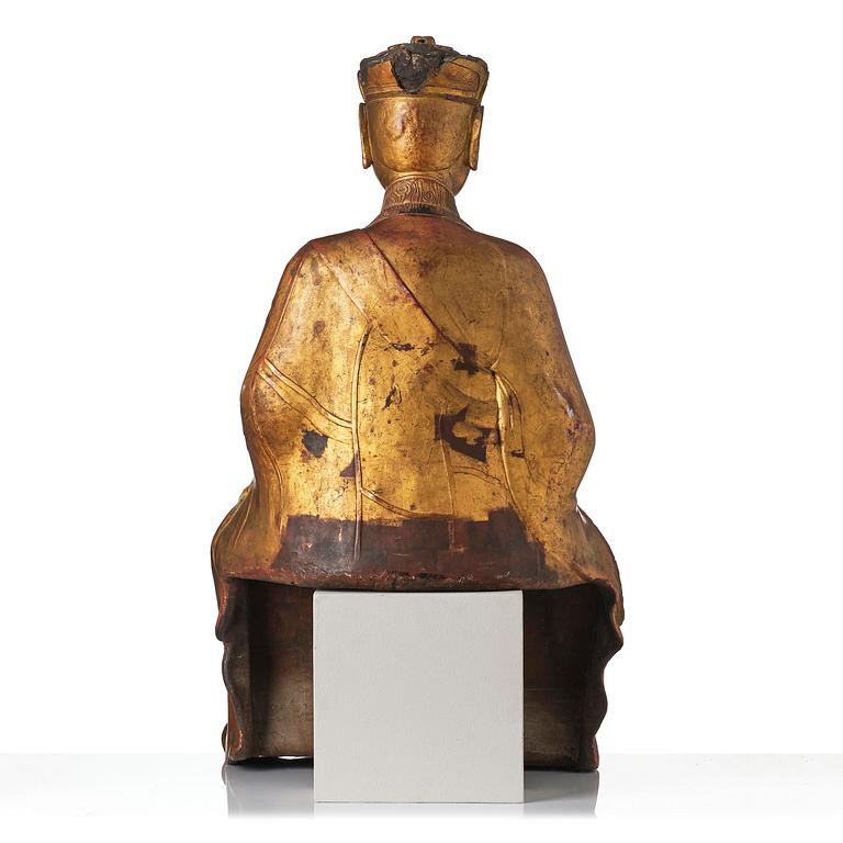 A large gilt lacquer figure of a deity, Vietnam, 19th century.