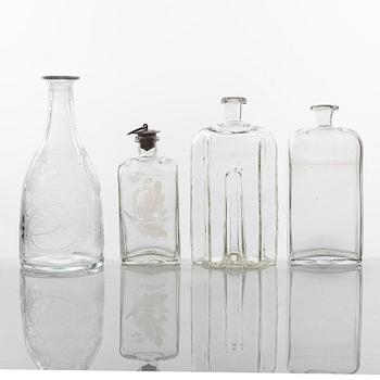 A set of three glass bottles and one decanter, 19th Century.