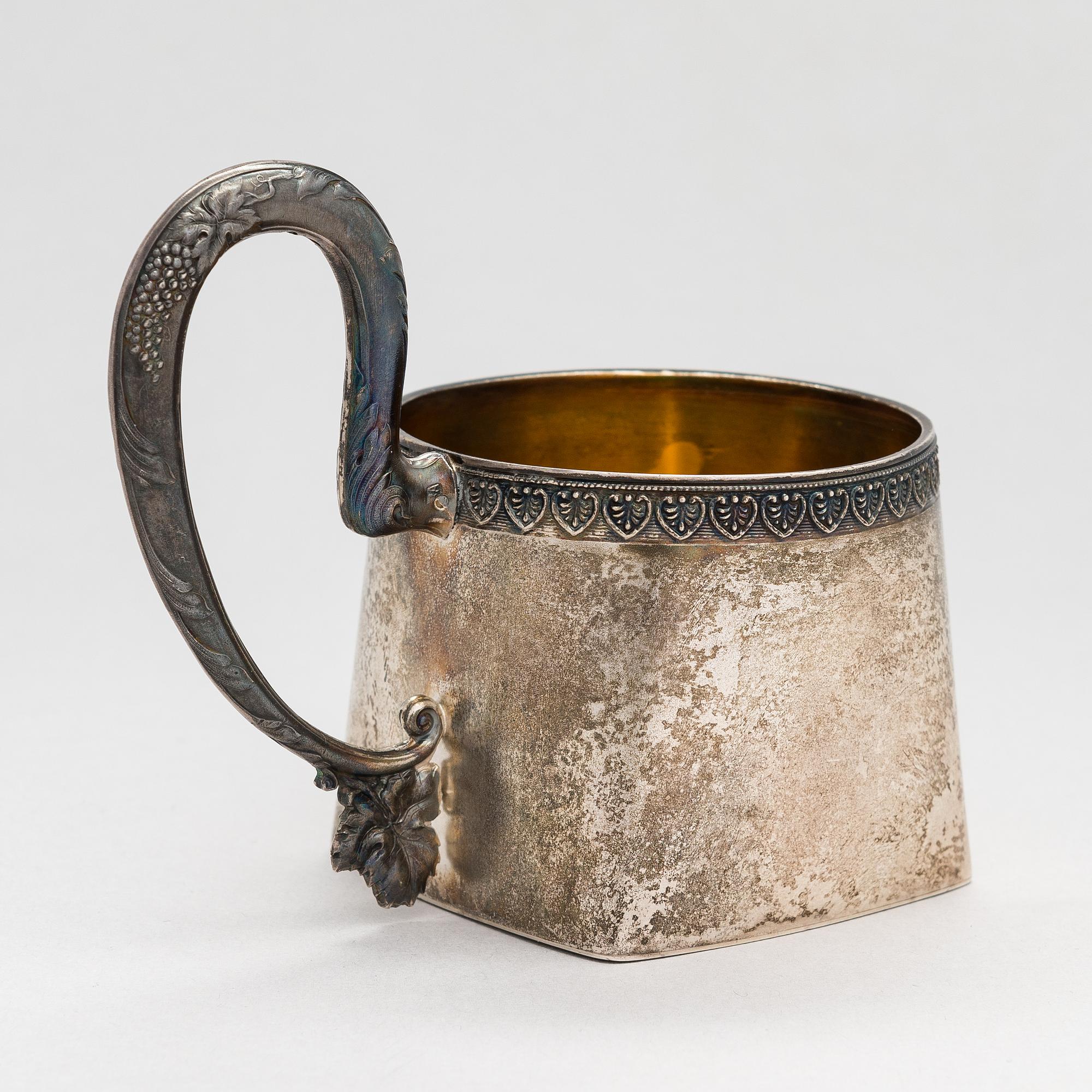 A parcel-gilt silver tea-glass holder, mark possibly of Vasily Andreyev, Moscow 1908-17.