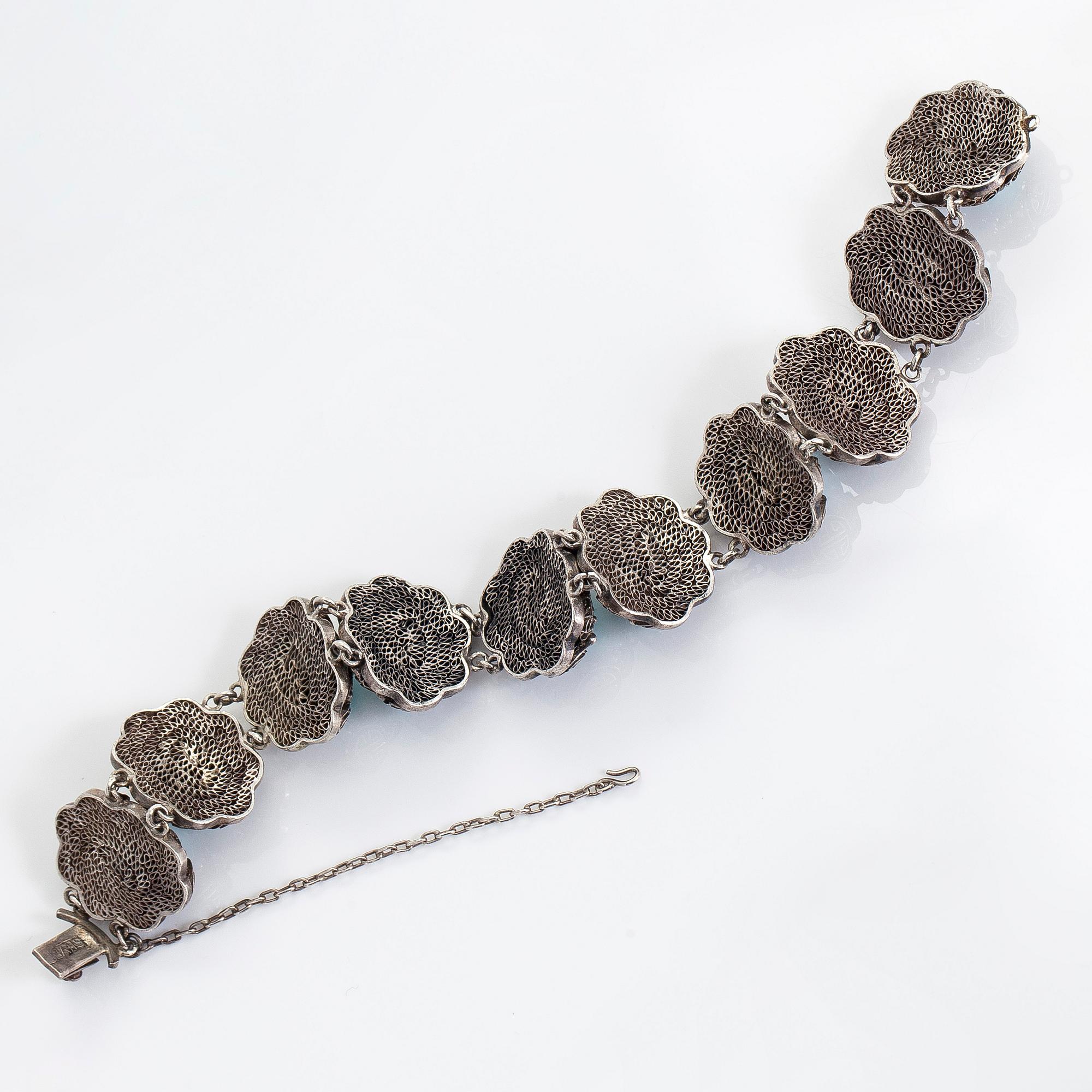 Armband samt örhängen, silver och turkoser. Importstämplad Risto Aho, Helsingfors 1964.
