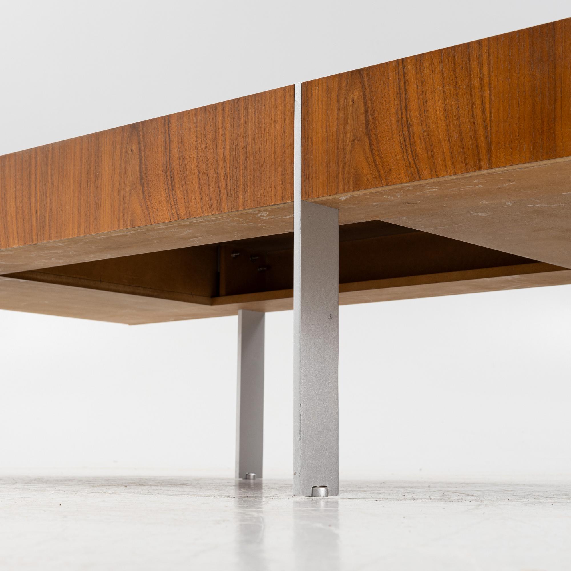 A 1970's/80's walnut-veneered coffee table.