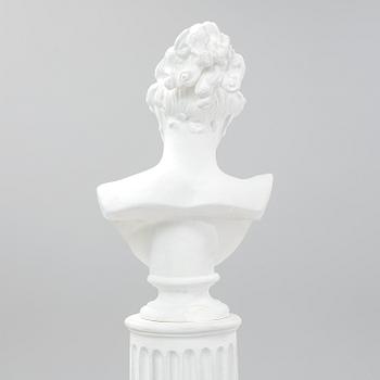 A plaster bust and pedestal.