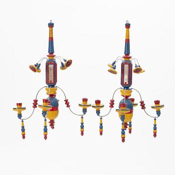 A pair of painted wood four-light chandeliers, second half of the 20th Century.