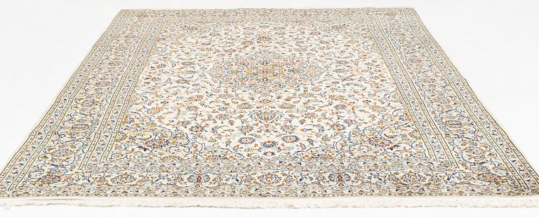 A Keschan carpet, signed, c. 350 x 245 cm.