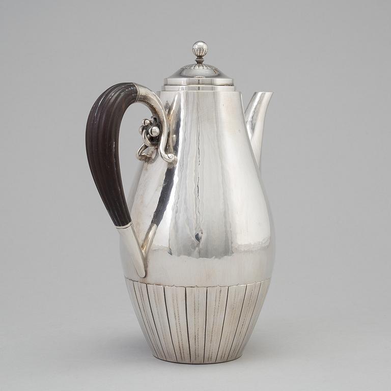 A three piece sterling silver coffee service "Cosmos" design Johan Rohde for Georg Jensen, Copenhage.