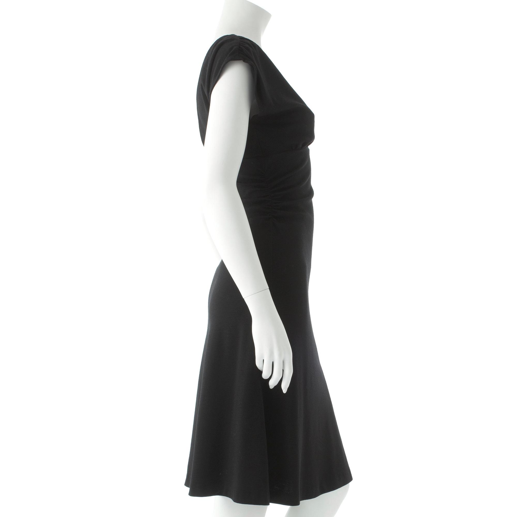 DIANE VON FURSTENBERG, a black wool dress.