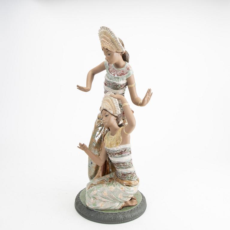 A Lladro stoneware figurine.