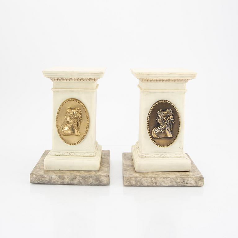 A pair of modern plaster statues of Napoleon.