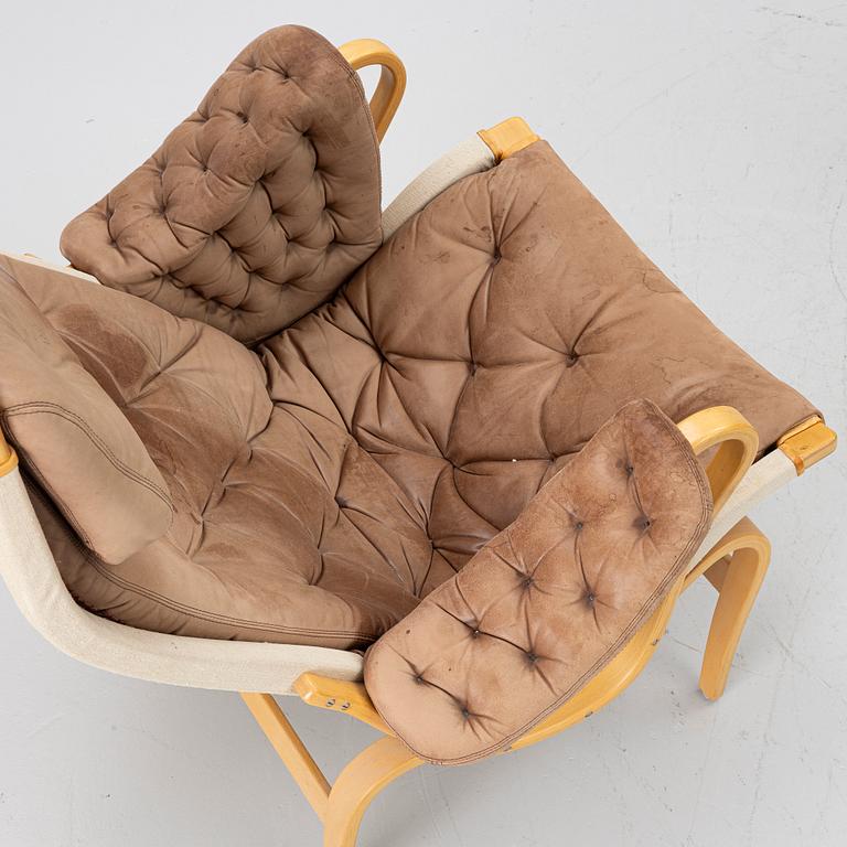 Bruno Mathsson, a 'Pernilla' armchair and ottoman, Dux.