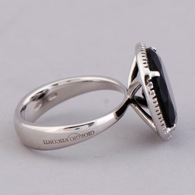 A RING, onyx, diamonds, 18K white gold. Italy.