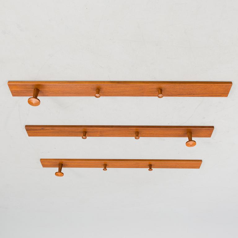 A set of three No. 140 wall coat hangers with manufacturer's mark.